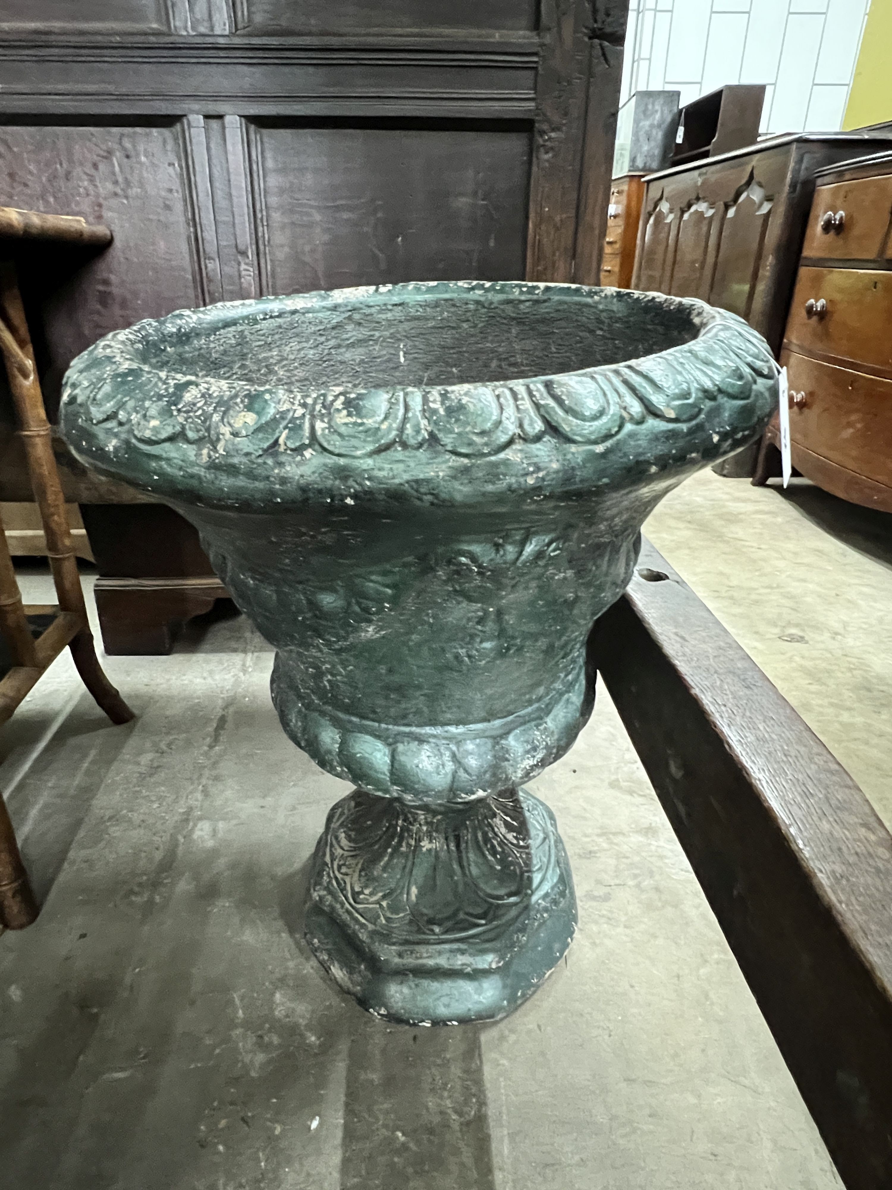 A circular painted reconstituted stone garden urn, diameter 48cm, height 64cm